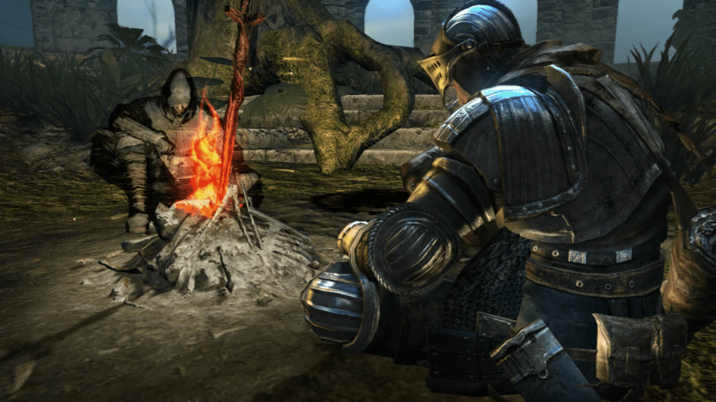 Imagem do Chosen Undead, protagonista do jogo Dark Souls, sentado em uma fogueira com um dos NPCs.