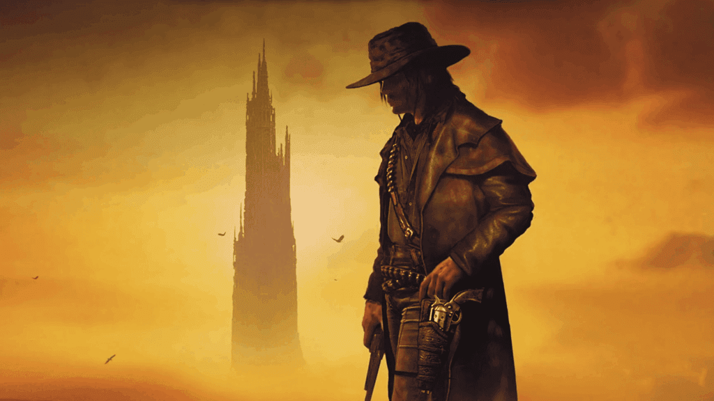 Capa de A Torre Negra I: O Pistoleiro. Ilustração de estilo sombrio e atmosférico, retratando um pistoleiro solitário de chapéu largo e sobretudo de couro, olhando para baixo enquanto segura um revólver. Ele está em um cenário desértico com tons dourados e alaranjados. Ao fundo, uma torre negra imponente e afilada se ergue no horizonte, envolta por uma névoa dourada e algumas aves voando ao redor (Foto: Divulgação/usatoday)