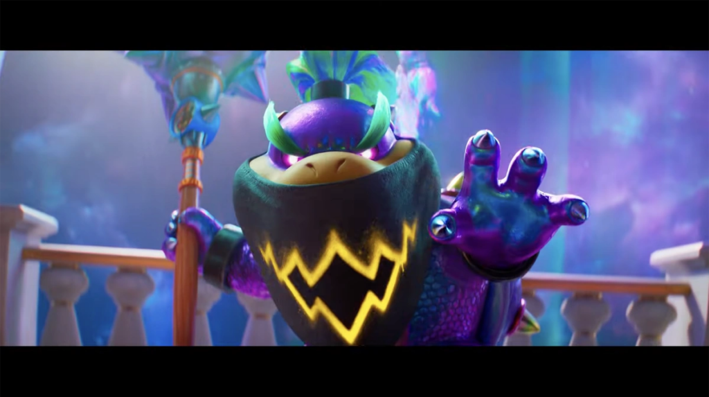 Bowser Jr. está em primeiro plano, transformado em uma versão mais poderosa, com a pele iridescente e os olhos arroxeados e brilhantes.